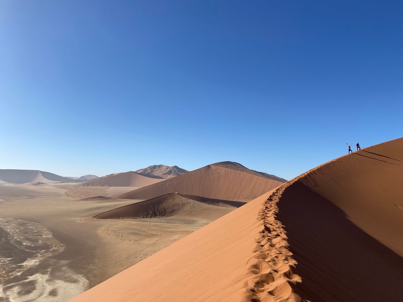 Climbing sandy dunes in Namib Desert